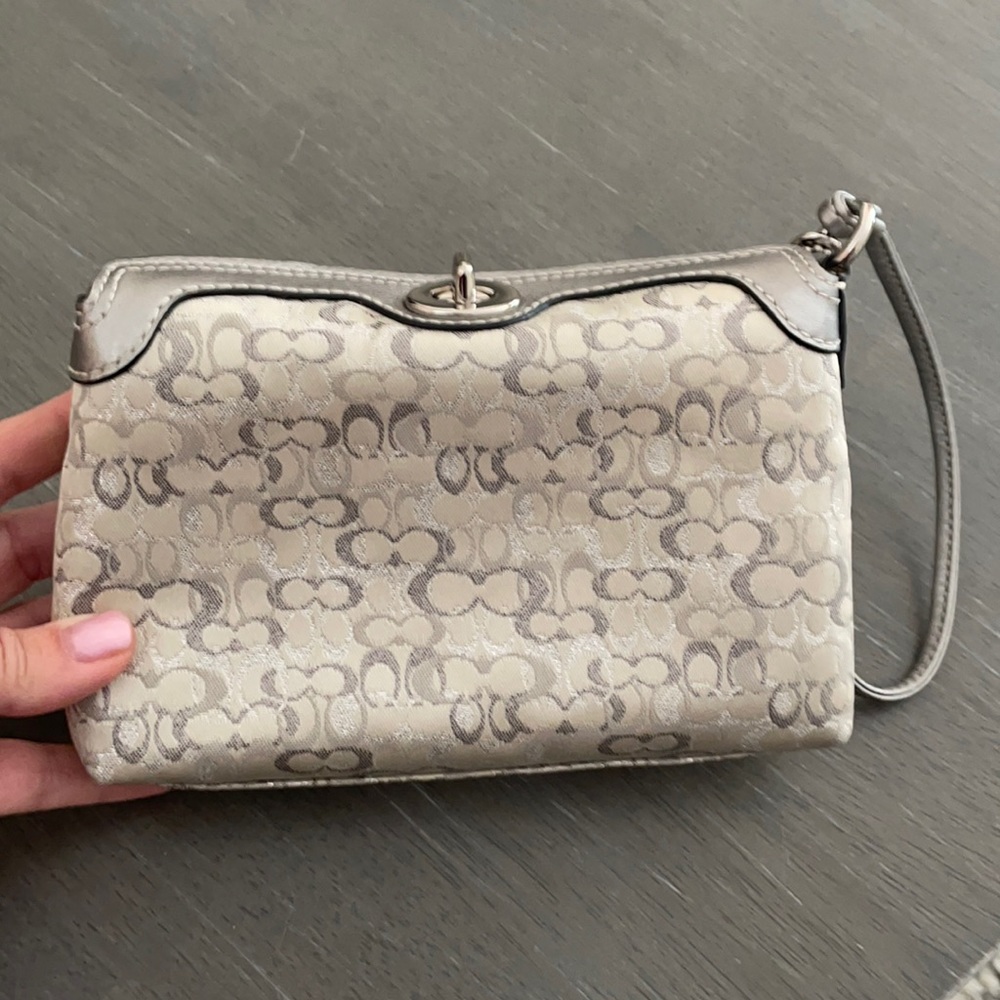 Adorable silver wristlet, barely used.